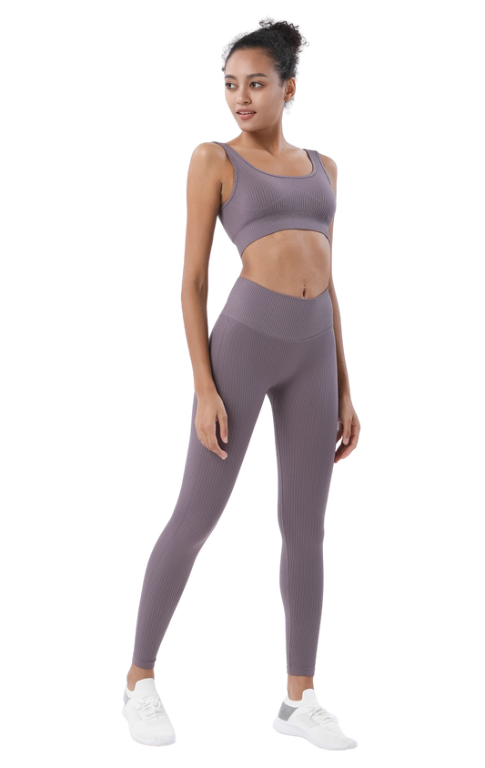 Premium Photo  A woman in a sports bra top and leggings jumping